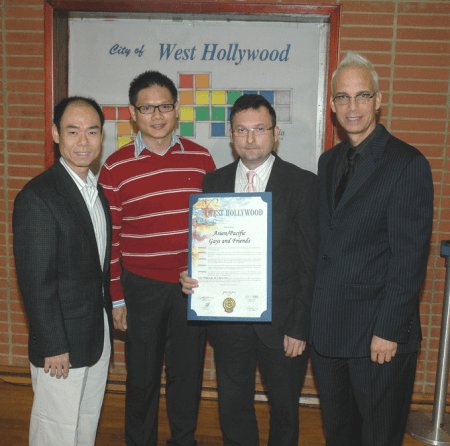 Members Jonathan O, Hoching J and President Rokas O accepting the proclamation from West Hollywood Mayor John Heilman